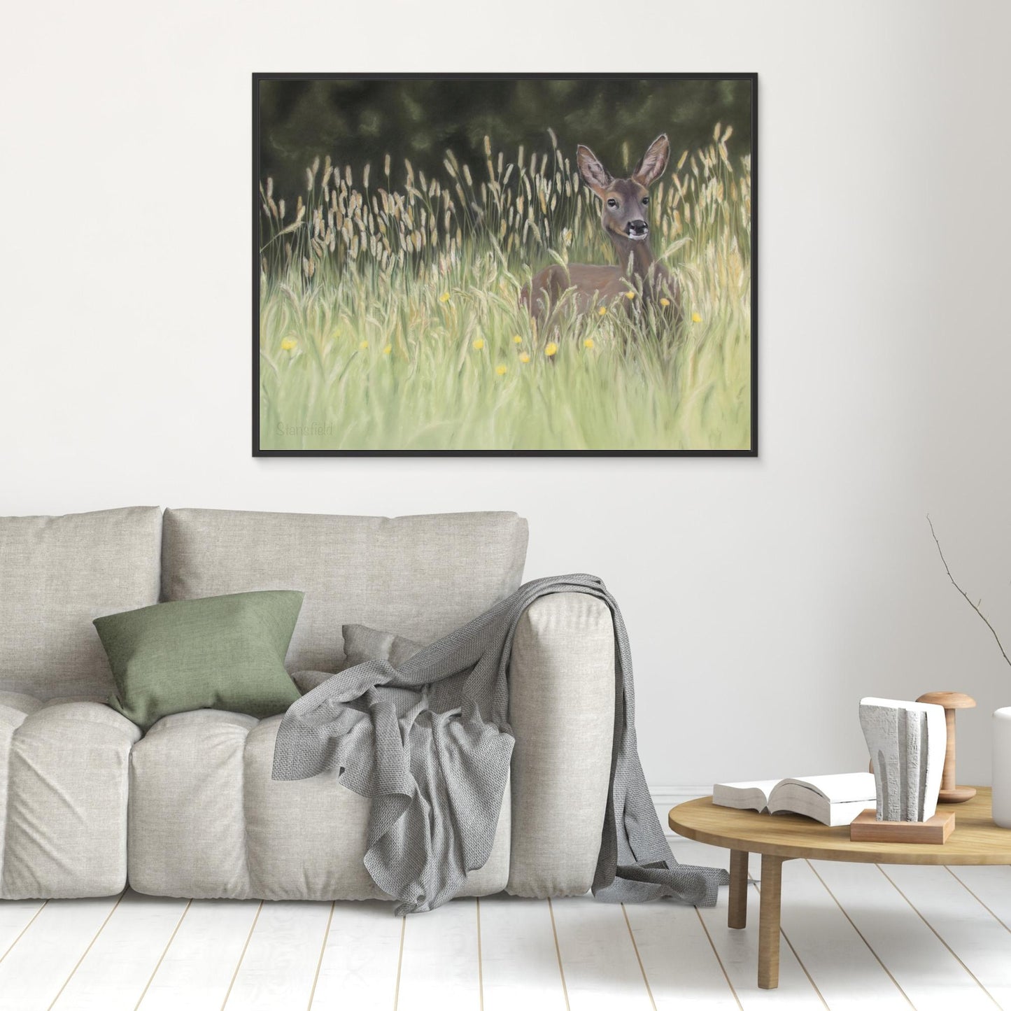 Pastel painting of wild deer on a framed stretched canvas in a room setting