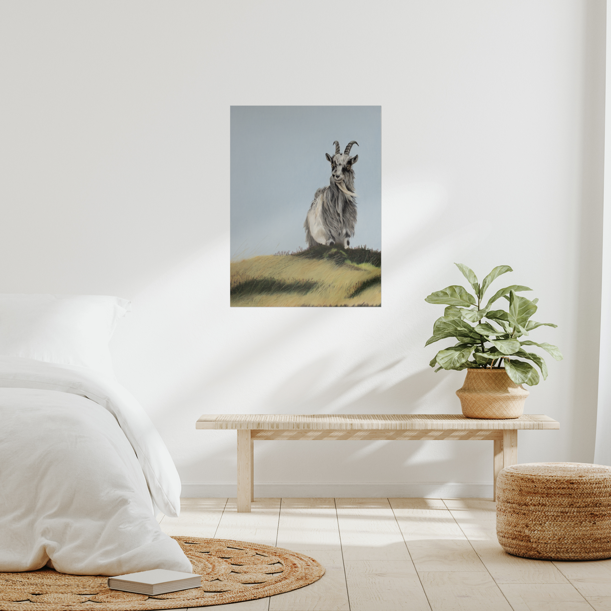 Bedroom interior with a painting of a wild goat on the wall