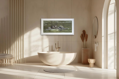 Picture of a framed original pastel otter painting from the west coast of Scotland placed in a bathroom setting. By Fiona Stansfield Fine Art.