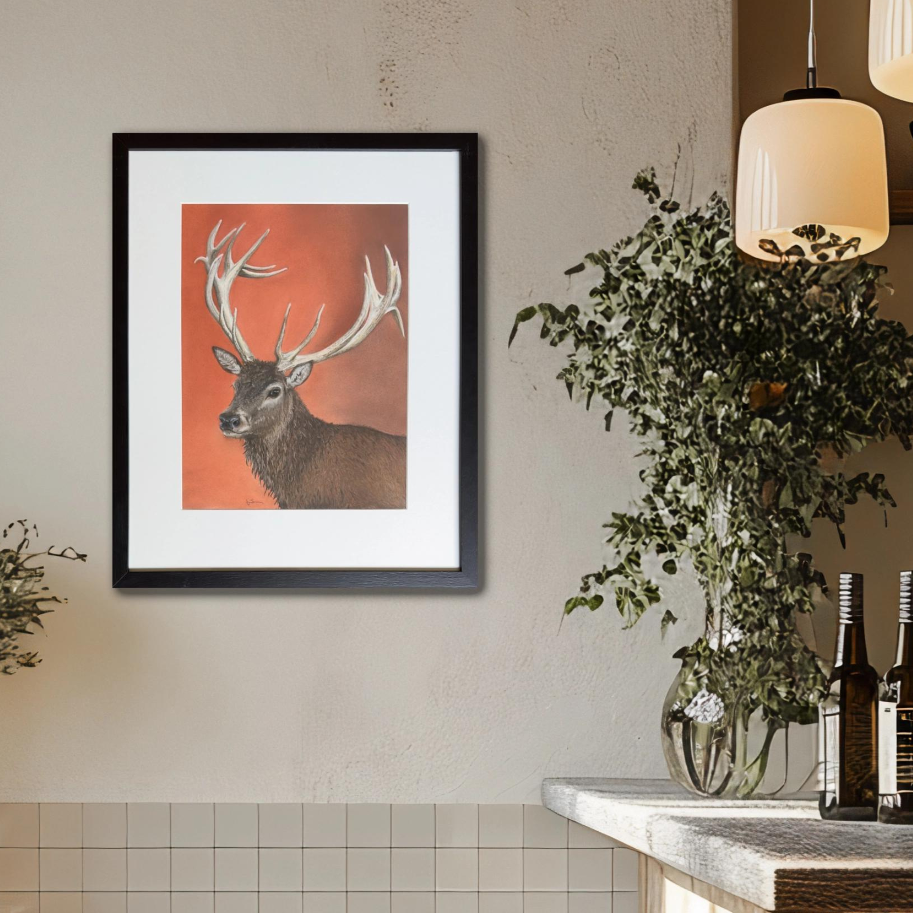 Closeup of a room display of a picture of a red deer stag with antlers in an original pastel painting by Fiona Stansfield Fine Art